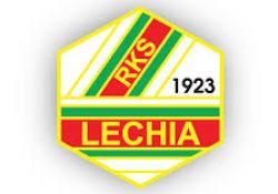 Na zdjęciu sześciokąt w barwach czerwieni, zieleni, żółci i bieli z napisami: Lechia, RKS, 1923 - logo Lechii